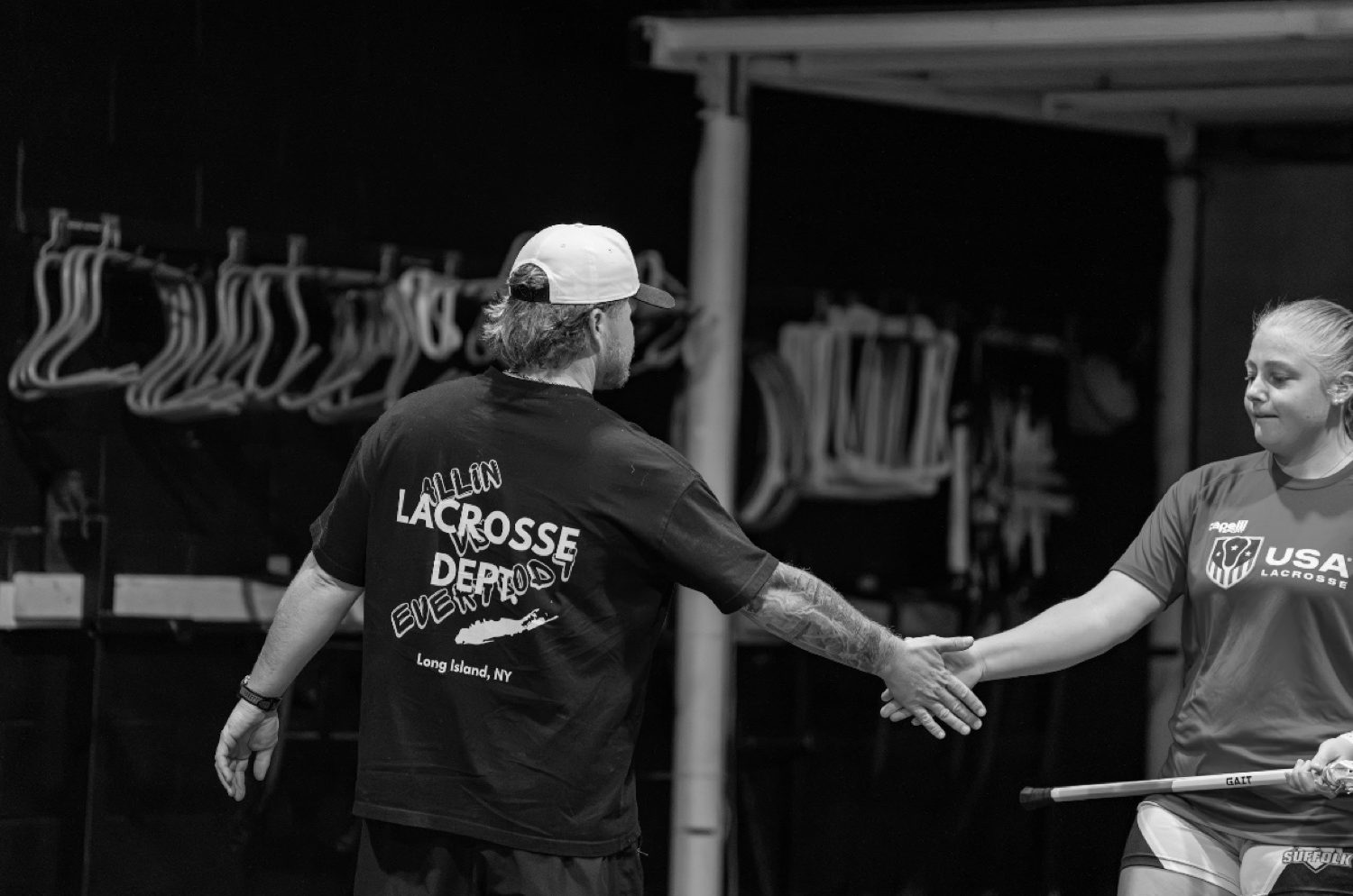 Coach McGinn high-fiving a player during training